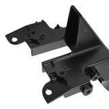 Black plastic automotive mounting bracket with precision cutouts, close-up view