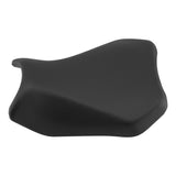 Black motorcycle seat cushion with ergonomic design on a white background